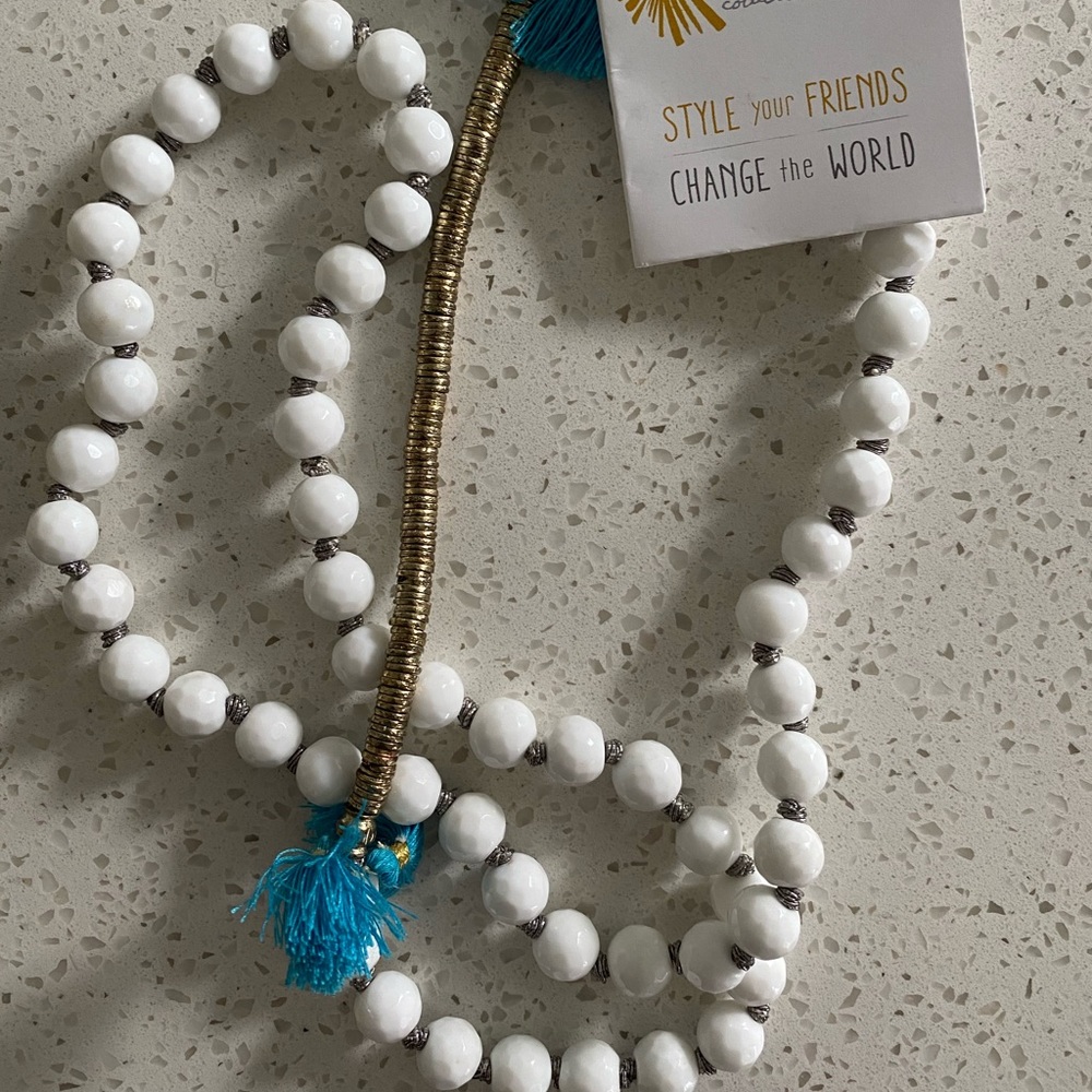 Noonday Necklace white beads with blue tassels